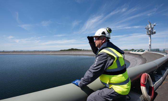 Engineer observing a hydro facility
