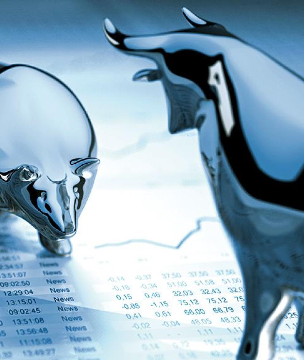 Stock image of bear and bull statues on a spreadsheet