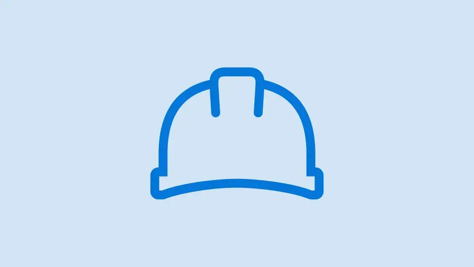 Blue icon of a safety helmet, symbolizing workplace safety and zero incidents.