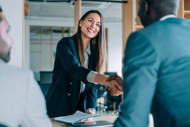 Employees shaking hands
