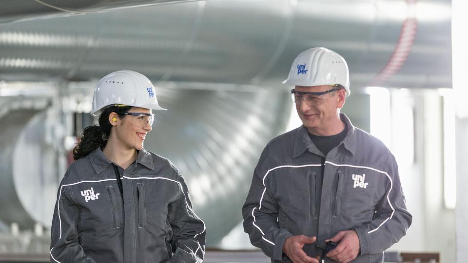Two engineers talking at plant in Datteln, Germany